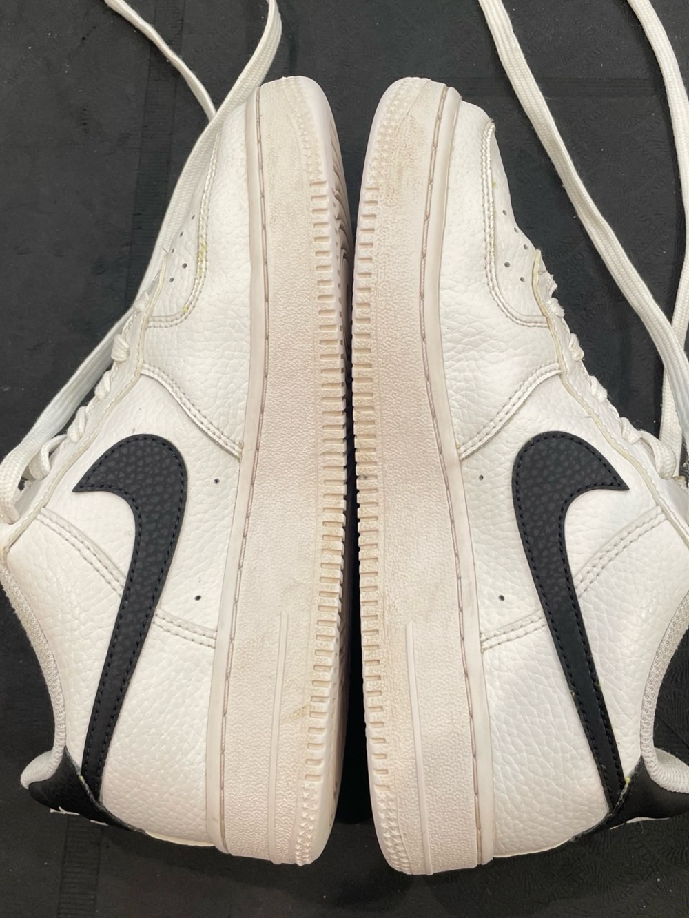Kids White and Black Low-Top Sneakers with Black Swoosh